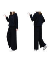 Women’s black two-piece casual suit with long-sleeve top and wide-leg pants, side view