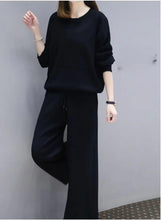 Women’s black two-piece casual outfit: loose long-sleeve top with matching wide-leg pants