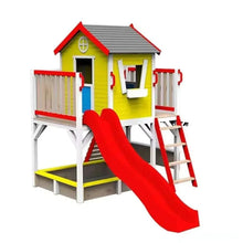 Outdoor wooden playhouse with yellow walls, red roof, and long red slide