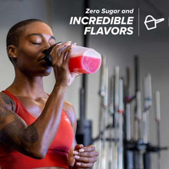 Athlete in red sports bra drinking pink shake from bottle in gym showcasing Cellucor C4 pre workout powder