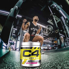 Cellucor C4 pre workout powder tub in front of athlete barbell squat in a commercial gym