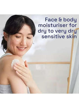 Moisturizing cream being applied to a woman's shoulder