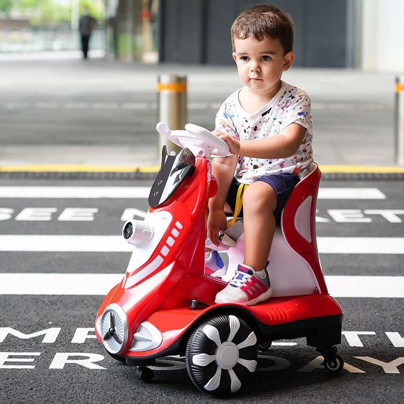 6V battery powered kids car with bubbles in red with a toddler riding outdoors on pavement