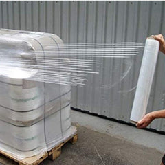 Huitich clear pallet wrapping roll 50cm being stretched to wrap goods on a wooden pallet