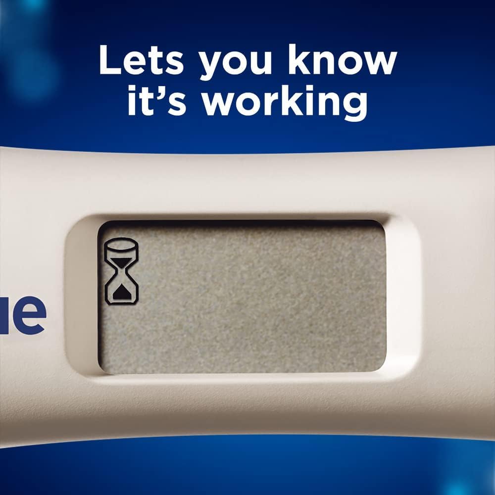 Close up of Clearblue digital pregnancy test UAE display with hourglass icon and Lets you know its working message