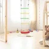 Climbing rope ladder with round colored plastic discs and red base on the floor