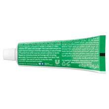 Closeup Triple Fresh Gel toothpaste tube back panel with ingredient and barcode text