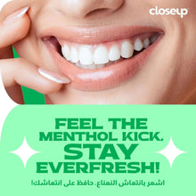 Closeup menthol fresh toothpaste ad featuring smiling teeth and mint kick text