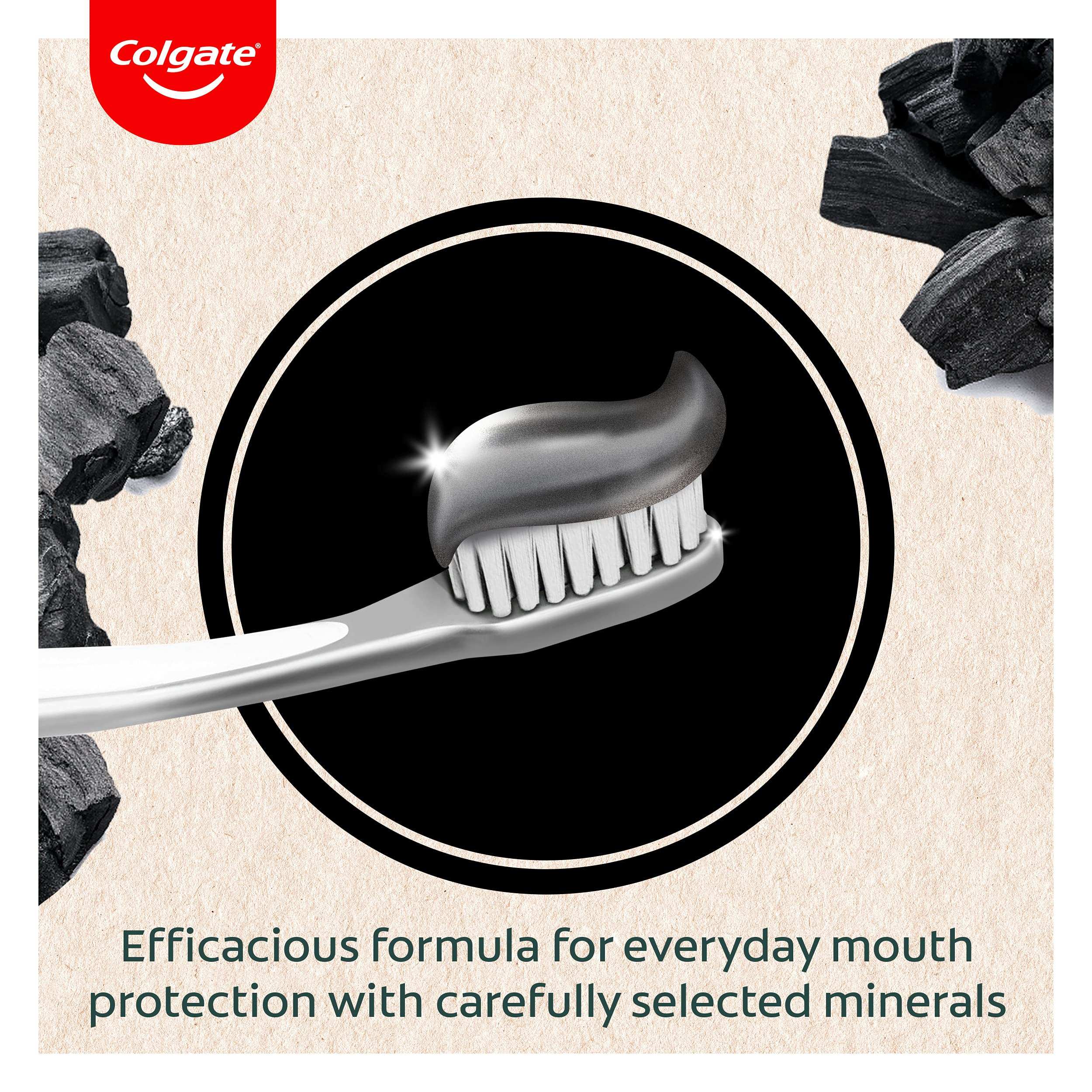 Colgate charcoal toothpaste UAE black charcoal paste on toothbrush with charcoal pieces and Colgate logo