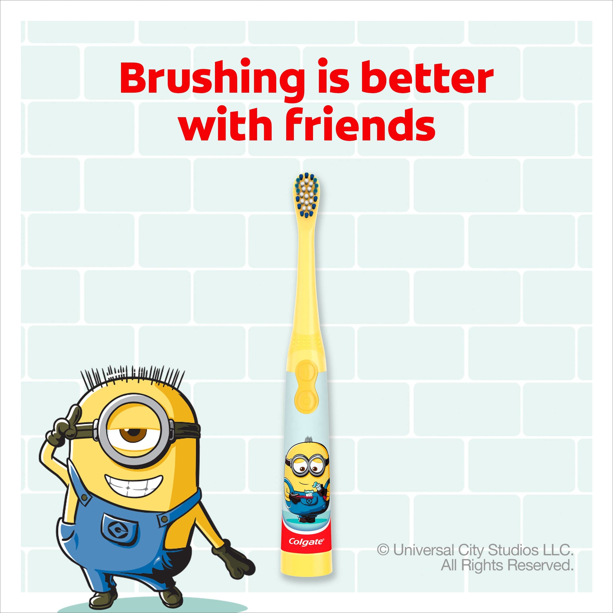 Colgate kids Minions toothbrush with yellow handle and smiling Minion character on tiled bathroom background