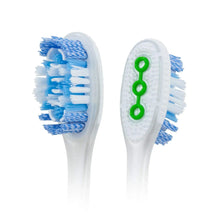Toothbrush pair with soft blue bristles and white handles, green accents, compact head