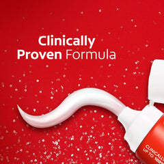 Colgate Optic White toothpaste tube dispensing white swirl on red background with clinically proven formula text