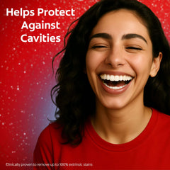 Smiling woman showing bright teeth using Colgate Optic White toothpaste with cavity protection