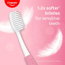Colgate toothbrush with ultra-soft bristles and pink grip area on handle
