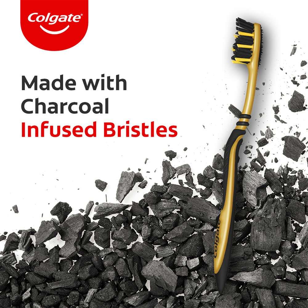 Colgate ZigZag charcoal toothbrush UAE gold and black toothbrush with charcoal infused bristles on charcoal background