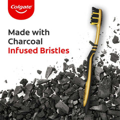Colgate ZigZag charcoal toothbrush UAE gold and black toothbrush with charcoal infused bristles on charcoal background