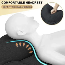 Dark folding camping cot with contoured headrest cushion and padded fabric surface