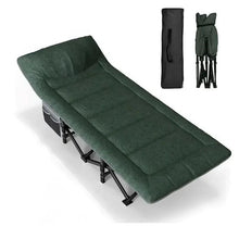 Green folding camping cot with cushioned mattress, black legs, and storage bag