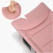Pink cushioned folding cot mattress with stitched panels and smooth fabric surface