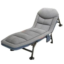 Gray cushioned lounge chair with headrest and padded seat, folding metal legs