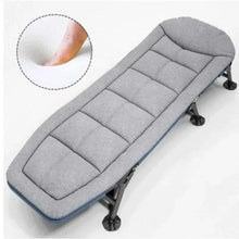 Gray padded folding lounge chair with segmented seat cushions and adjustable foot posts