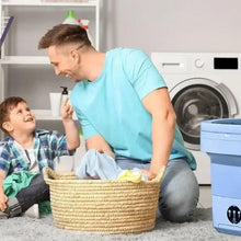 Portable compact laundry washer beside person holding clothes basket