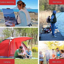 Folding camping chair with armrests in outdoor use setting on a platform