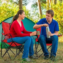 Red folding camping chair with armrests and black X-frame, mesh side pocket