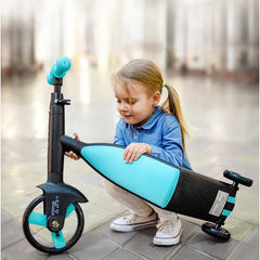 Huitich convertible tricycle for kids in black and blue with a young girl playing with it