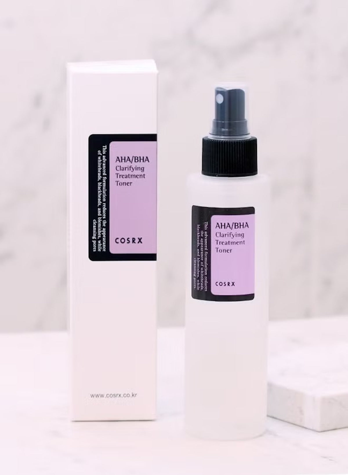 COSRX AHA BHA clarifying toner in a spray bottle with a purple label for skin clarity