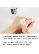 Toner applied to a cotton pad on the face, hands holding spray bottle