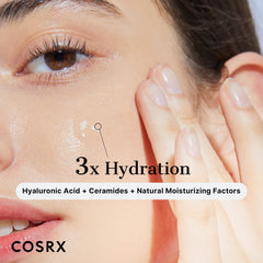 COSRX hyaluronic acid serum UAE close up of woman applying hydrating serum on cheek with 3x Hydration label