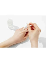 COSRX triple hyaluronic serum applied to skin with hands and dropper