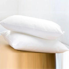 Huitich white cotton bed pillows set stacked on wooden surface for comfortable sleep