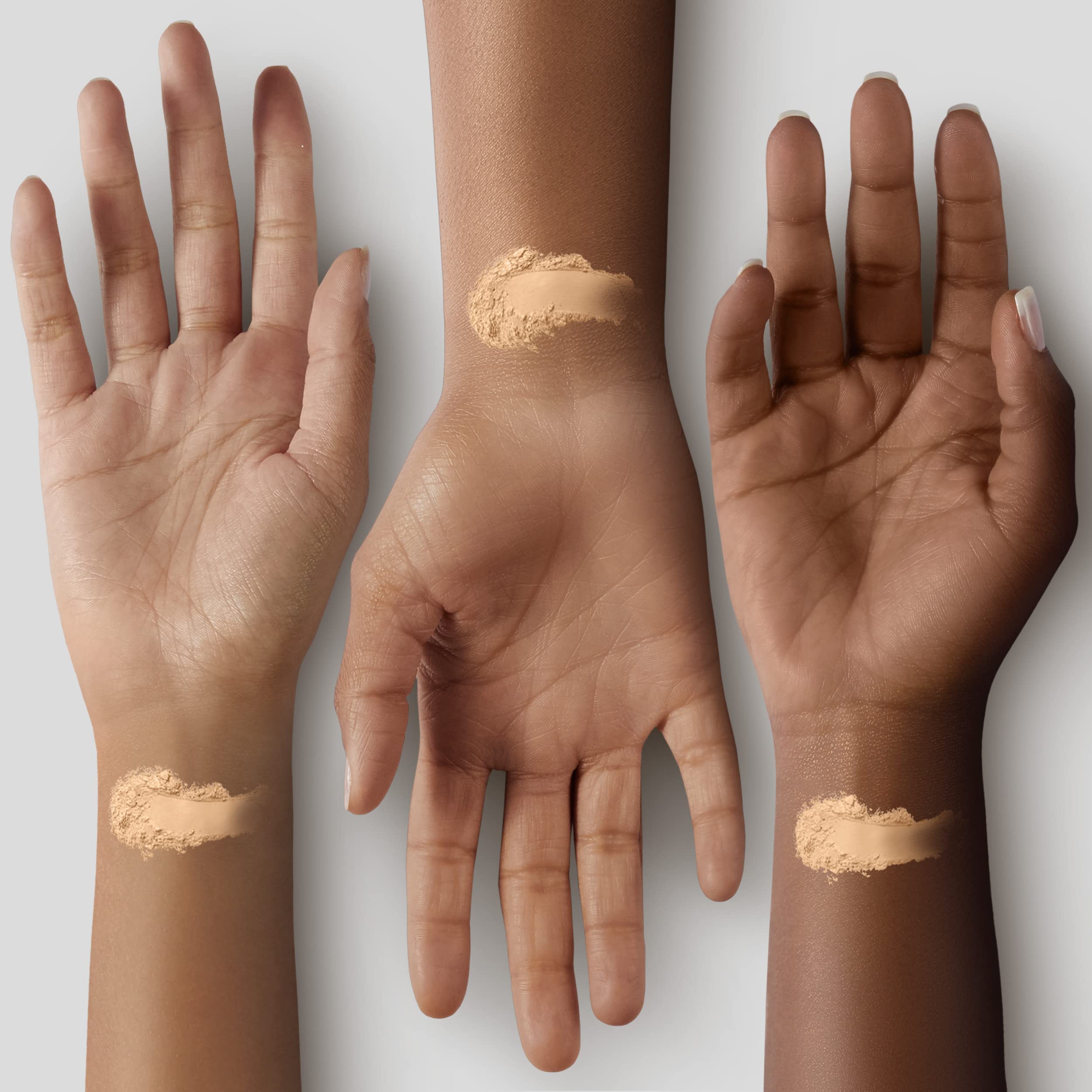 COVERGIRL oil control face powder for oily skin swatched on three different skin tones on inner wrists