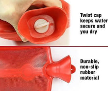 Red hot water bottle close-up showing twist cap and ridged rubber surface