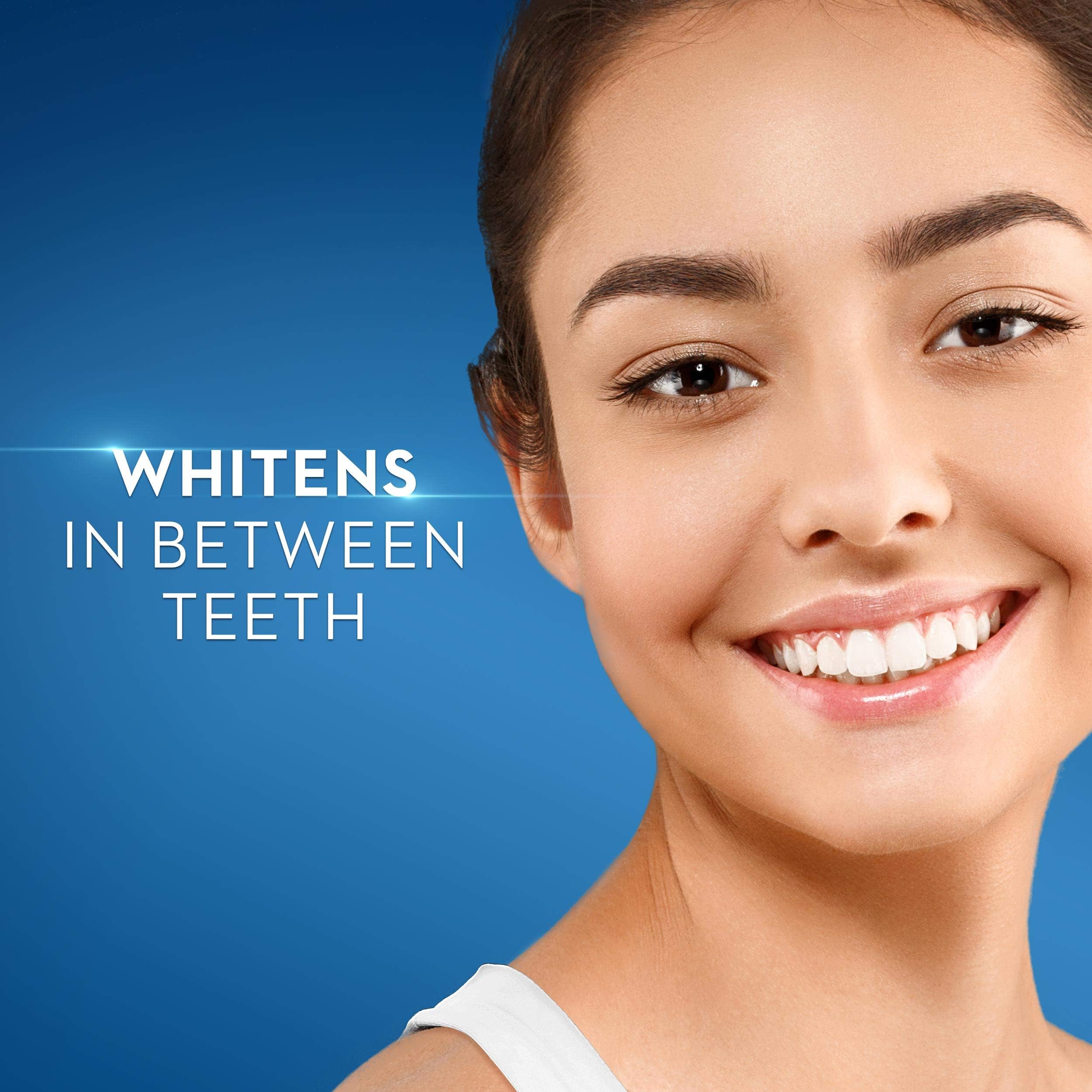 Crest 3D White toothpaste UAE ad showing smiling woman with bright white teeth and text whitens in between teeth