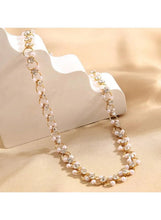 Gold-tone crystal choker necklace with round rhinestone drops, worn on a mannequin neck