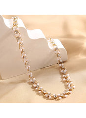 Huitich elegant crystal choker necklace with gold chain and pearl accents on beige background