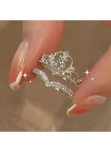 Crystal crown ring with crown-shaped setting and rhinestone border, silver tone