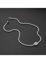 Silver-tone crystal tennis necklace with rectangular pendant and sparkle chain