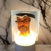 Portrait table lamp with white rectangular shade and bearded face print, dark base