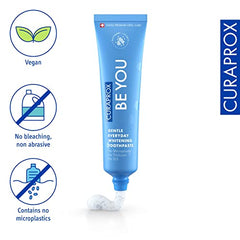 Curaprox Be You gentle whitening toothpaste. Blue tube with speckled white paste and vegan no microplastics icons