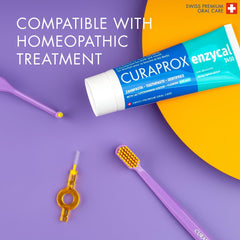 Curaprox Enzycal 1450 toothpaste UAE tube with purple toothbrush and interdental brush on colorful background