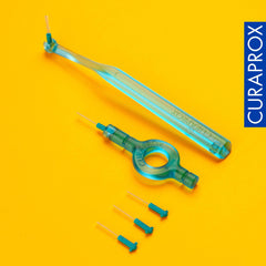 Curaprox interdental brushes starter set turquoise handles and extra small brush heads on yellow background with Curaprox logo