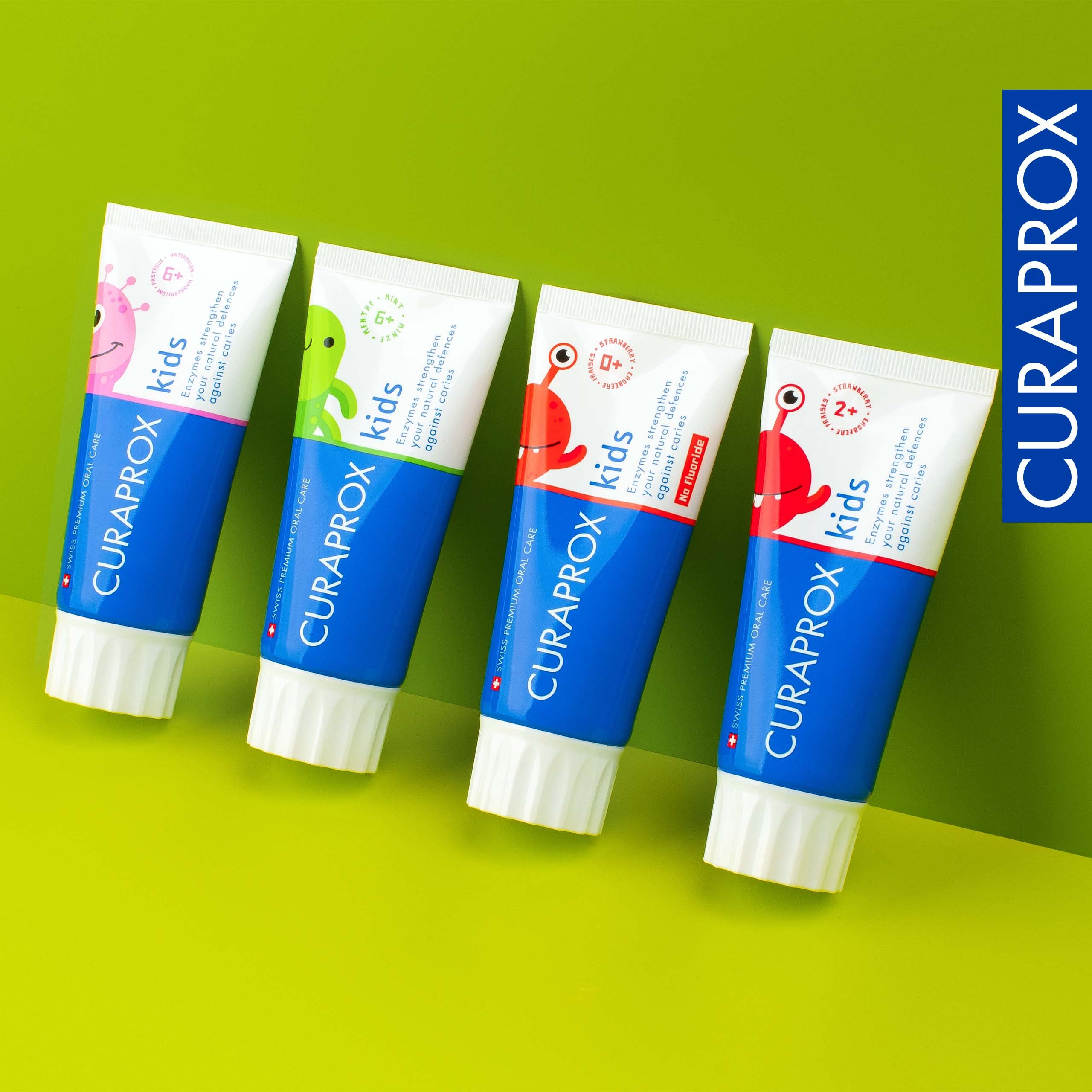 Curaprox kids fluoride toothpaste strawberry flavor tubes in colorful packaging set of four