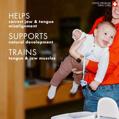 orthodontic baby pacifier UAE on smiling baby held by parent blue pacifier attached with clip highlighting jaw support
