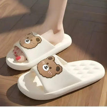 White bear slide slippers with cartoon bear patches on both shoes