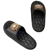Dark slip-on slippers with bear-face patch and textured tread sole