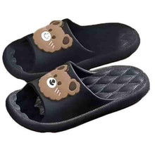 Novelty slippers with dark uppers and bear-face patches